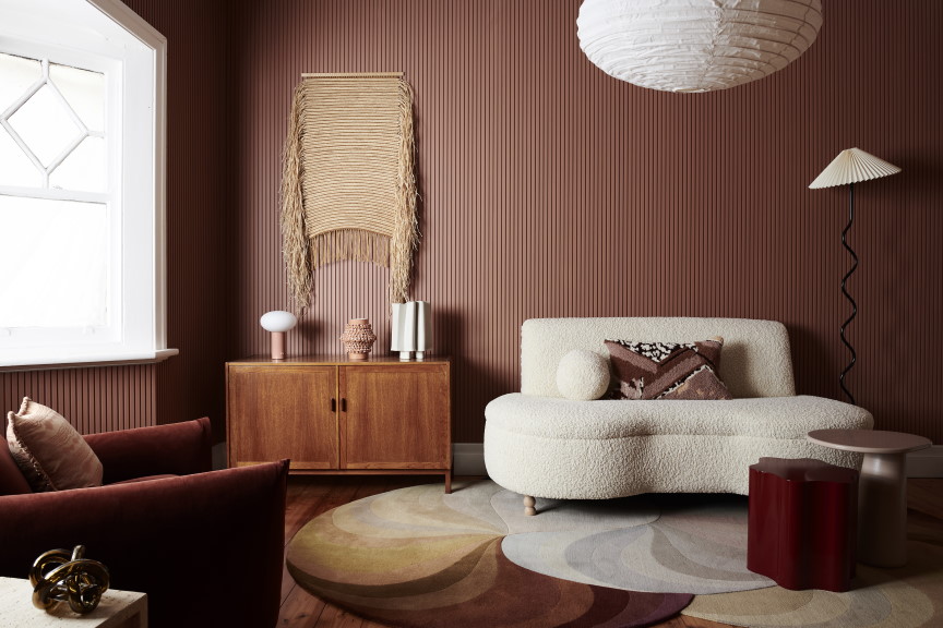 Surround by Laminex Batten 25 wall panels add texture to this living room.